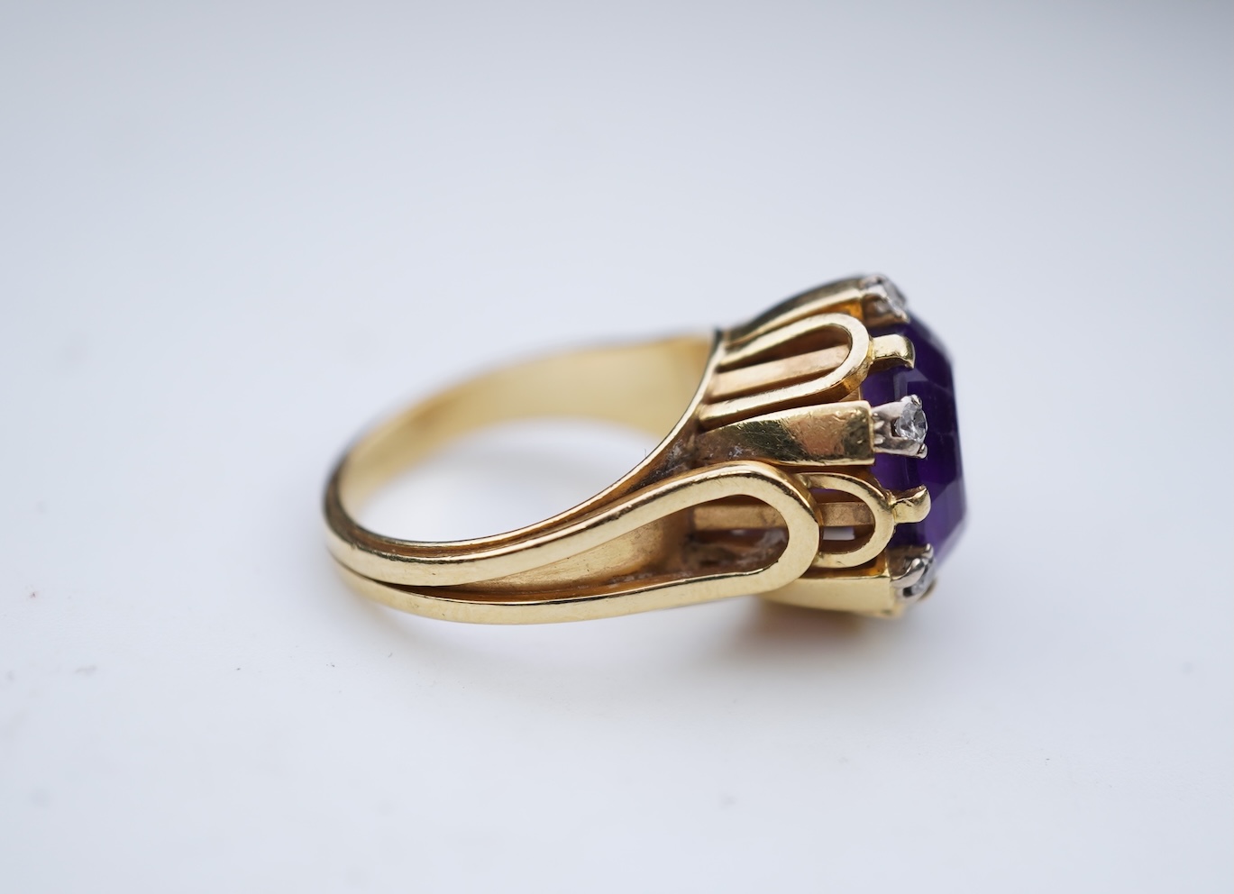 A stylish amethyst and diamond ring